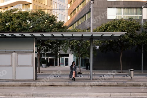 Preview: tram stop with a woman waiting for the train