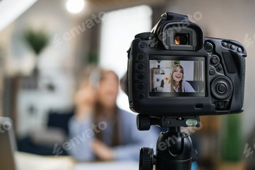 Preview: Woman in headset using camera for recording video