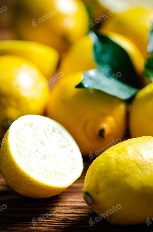 Preview: Fresh lemons. On wooden table.