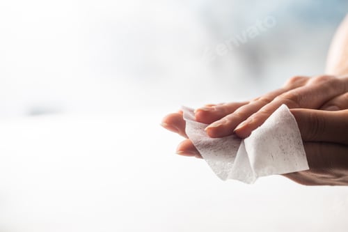 Preview: Woman hands with wet wipe