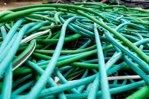 Preview: Outer casings of pvc electrical cables, abandoned and discarded, ready for recycling.