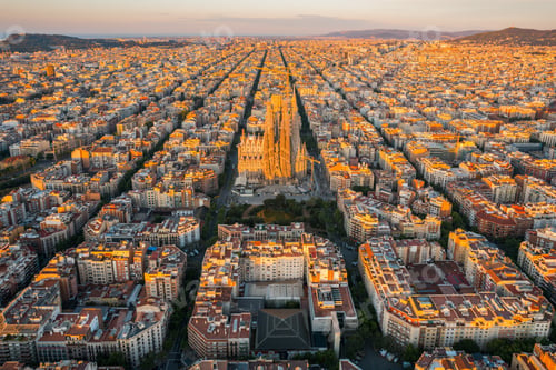 Preview: Aerial view of Barcelona Eixample residential district and Sagrada Familia Basilica at sunrise
