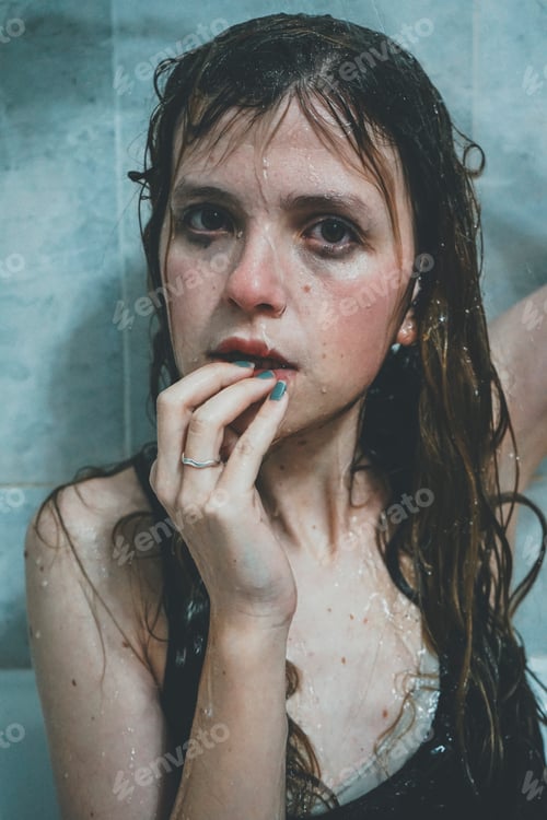 Preview: Artistic portrait of a young woman under shower water