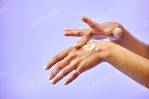 Preview: Hands, dry skin and woman with cream for studio skincare, cosmetics or wellness on purple backgroun