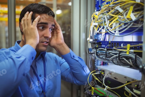 Preview: Technician Getting Stressed Over Server Maintenance In Server Room