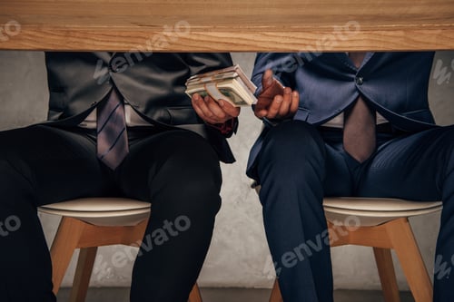 Preview: cropped view man giving money to business partner while sitting on chair