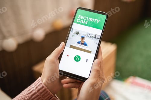 Preview: Delivery man ringing door bell on cctv secure camera system on mobile phone app