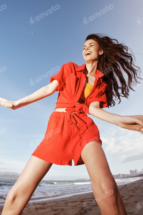 Preview: Joyful Summer Dancing by the Sea: Smiling Woman Embracing Freedom and Embracing Life