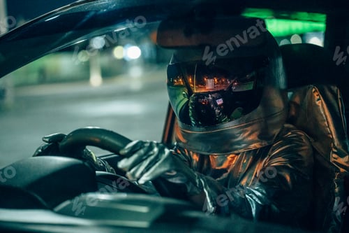 Preview: Spaceman driving car at night