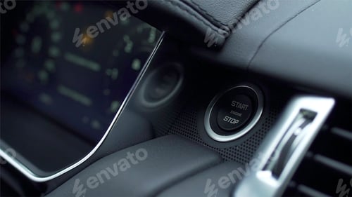 Preview: Engine start stop button of a car. Stock