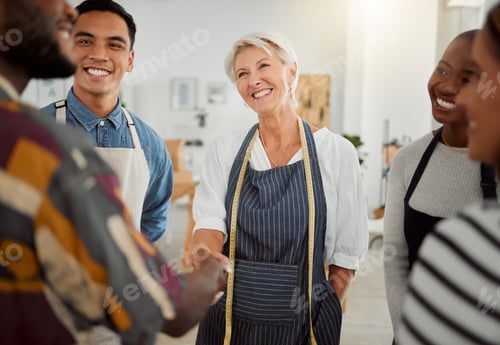 Preview: Group of happy diverse creative designers having a meeting while standing together at work. Coworke