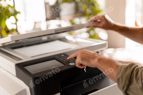 Preview: Office worker using multifunction printer in the office