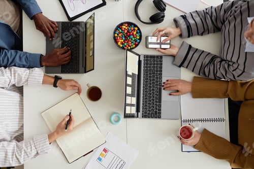 Preview: Team using computer at meeting table