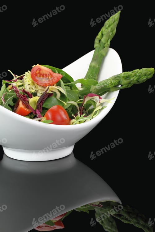 Bright Salad in White Bowl on Black