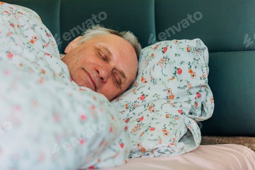 Preview: elderly man sleeps in his bed at home on a pillow