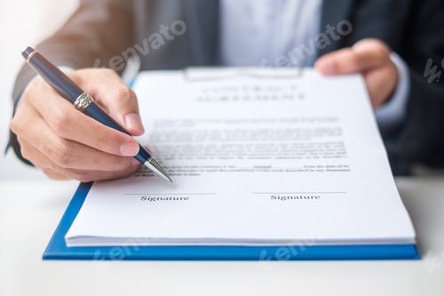 Preview: Businessman signing on contract documents after reading, man holding pen and approve