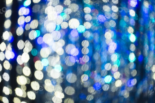 Preview: Multi coloured bokeh lights with copy space on dark background