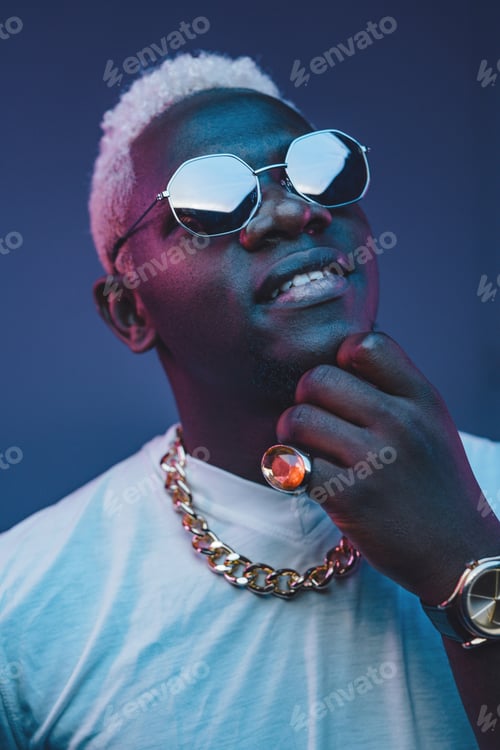 Preview: Stylish african guy with white hairs against dark background