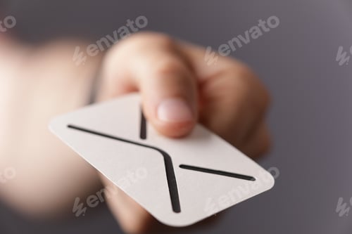 Preview: Man's hand holding the sign of message-concept of online communication