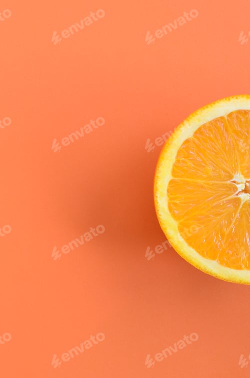Preview: Top view of a one orange fruit slice on bright background in orange color. A saturated citrus