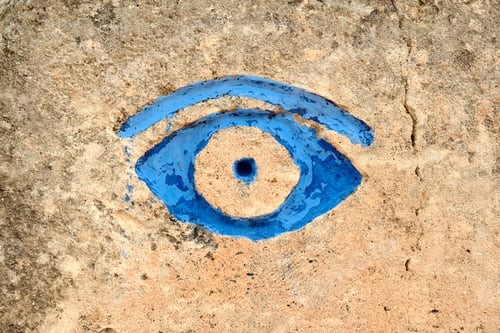 Preview: Blue eye painted on stone wall at Lithica