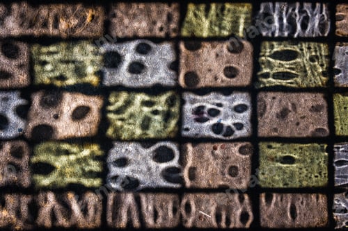 Preview: High angle shot of a colorful window glass shadow on the ground