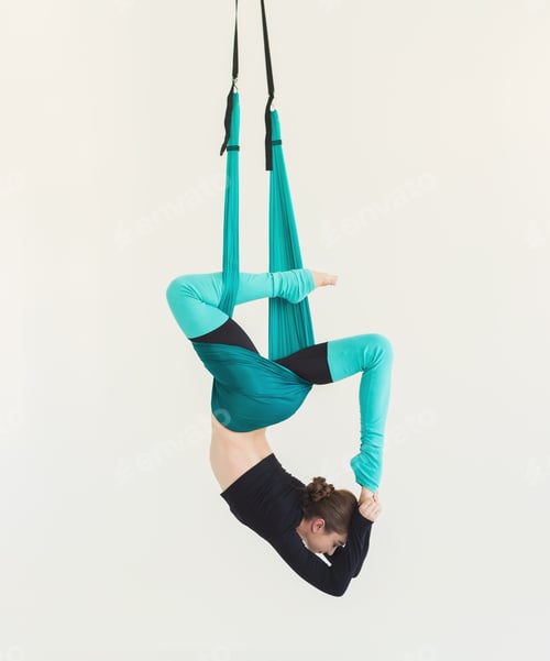 Woman Doing Aerial Yoga in a Hammock
