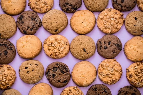 Preview: Array of Delicious Cookies on Light Purple Background