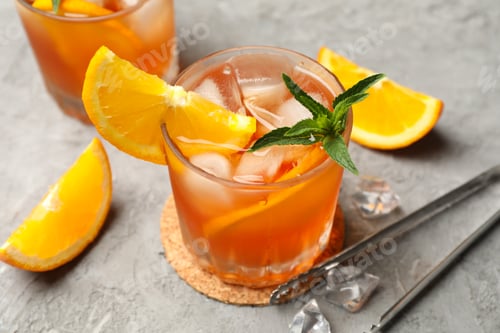 Preview: Composition with aperol spritz cocktail on gray background. Summer drink