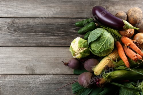 Preview: Different fresh ripe vegetables on wooden table, flat lay with space for text. Farmer produce