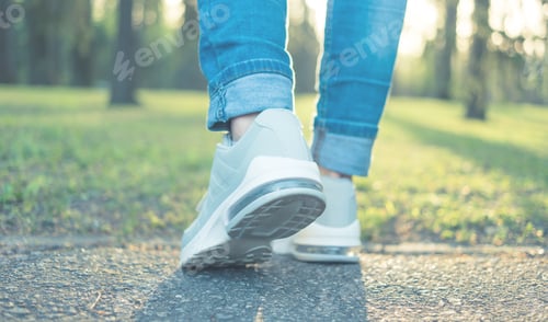 Preview: Walking in gray running shoes, back to camera