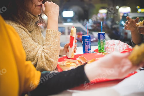 Preview: close up of women eating in fast food