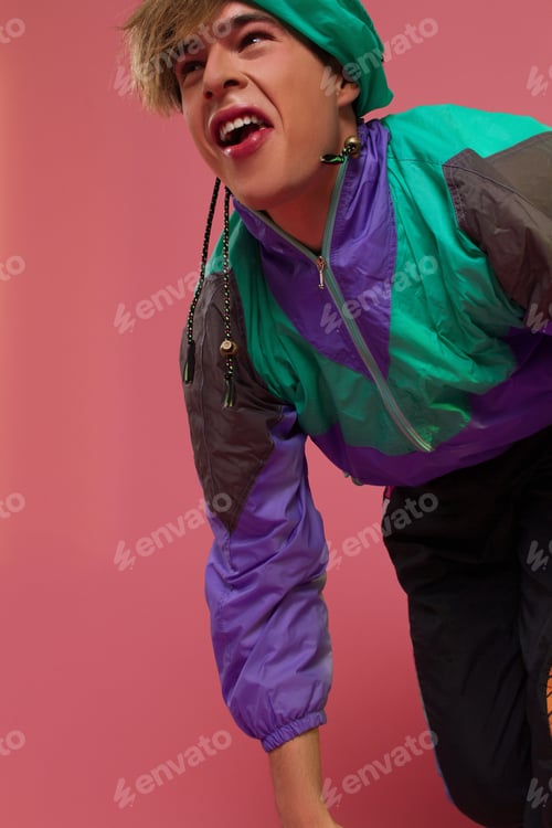 Preview: A Guy Hipster In A Sports Suit Posing On A Pink Background