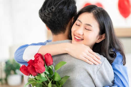 Preview: Asian couple Showing love surprise giving flowers