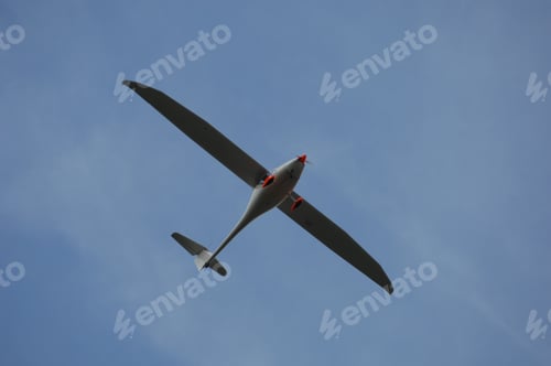 Preview: Low angle shot of a Skysurfer Glider under a blue sky
