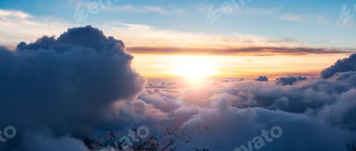 Preview: Sun Rises Above Snowy Mountain and Clouds
