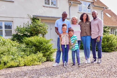 Preview: Portrait Of Smiling Multi-Generation Family Standing Outside Home Together