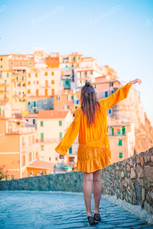 Preview: Tourist looking at scenic view of Manarola, Cinque Terre, Liguria, Italy