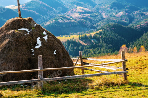 Preview: A large haystack against the backdrop of the wonderful nature of the Carpathians and the