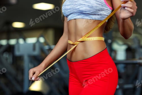 Preview: Woman measuring perfect shape of beautiful waist