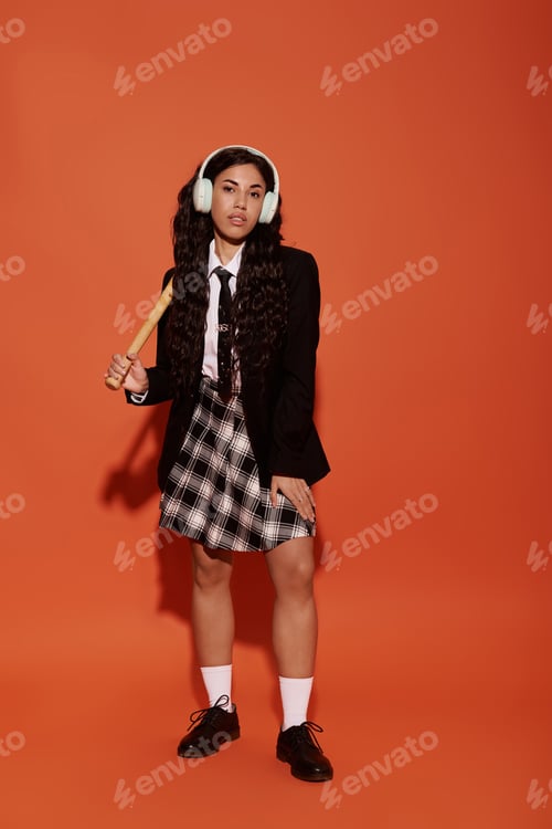 Preview: Young student exudes confidence and creativity with striking wardrobe against vibrant backdrop