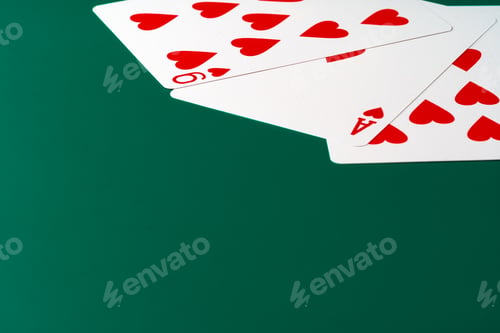 Preview: Playing cards on paper background close up