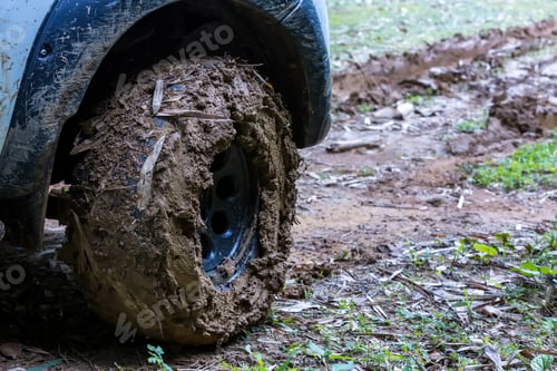 Preview: Tire has been mired in the mud. Wheel closeup with a muddy. Wheel of tire is dirty because mud