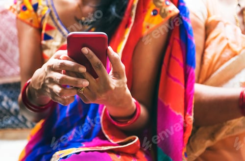 Preview: Indian woman using mobile phone