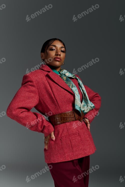 Preview: Stylish young African American woman showcasing modern fashion in a studio setting