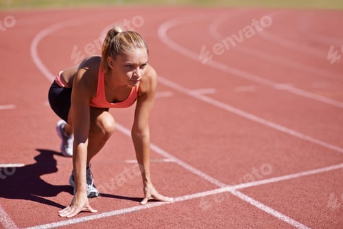 Preview: Ready for a race. Shot of an attractive young runner out on the track.