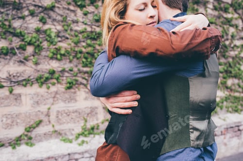 Preview: Young couple hugging outdoor smiling