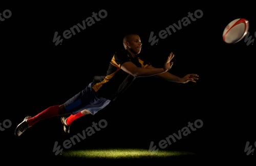 Preview: Rugby player diving whilst passing ball