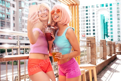 Preview: Two young beautiful women posing outdoors