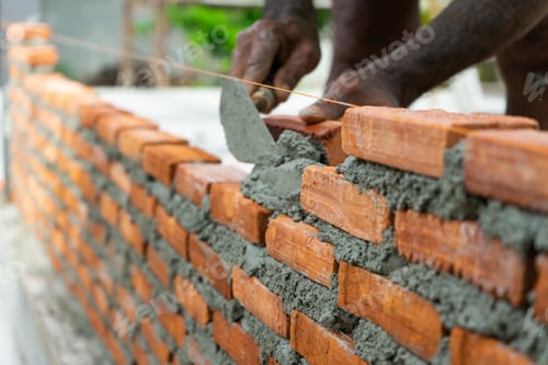 Preview: Worker uses trowel during installing the bricklayer wall